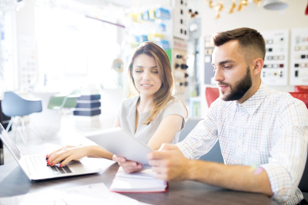 Two Sales Managers in Shop